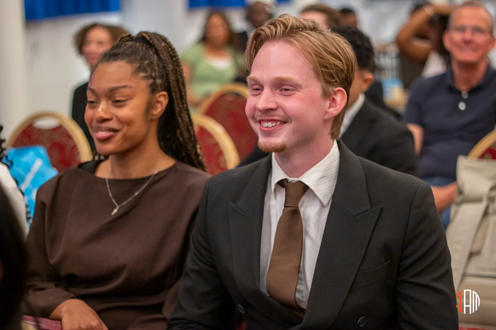 Two people smiling in the congregation