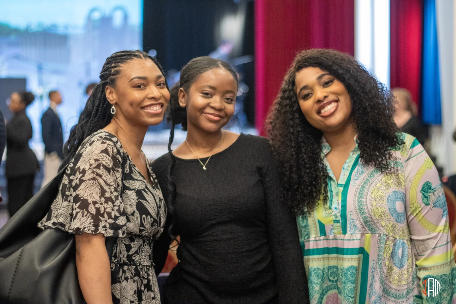 Three women smiling together at church
