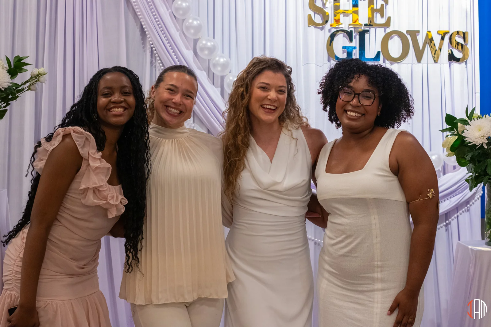 Four women together at the She Glows event